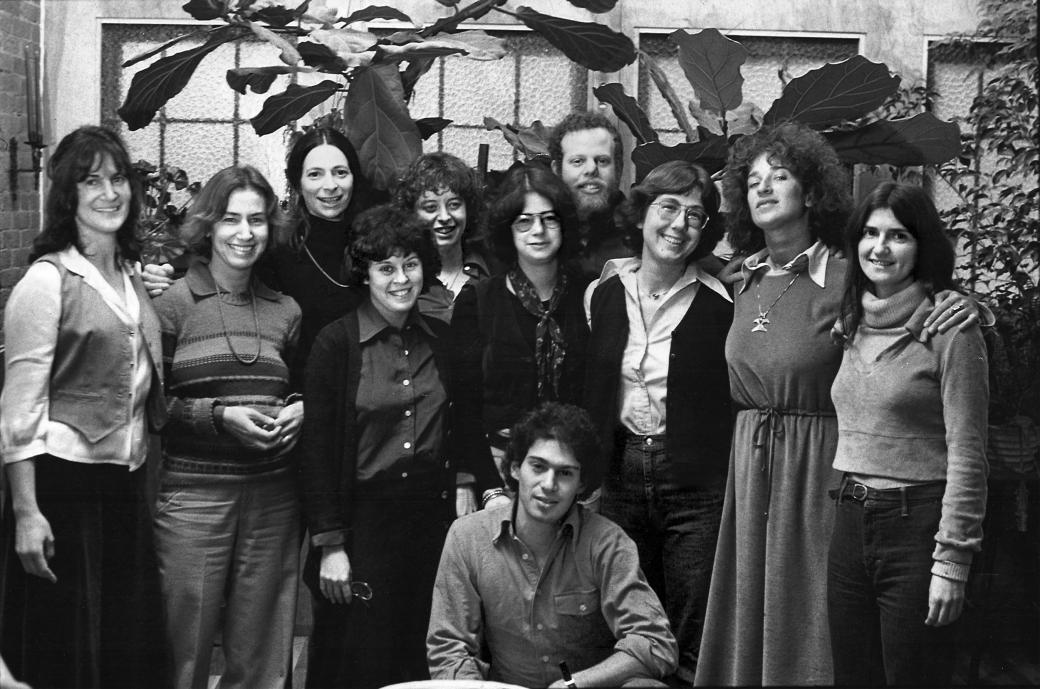 B&W group shot of Newday members in front of a cactus tree.