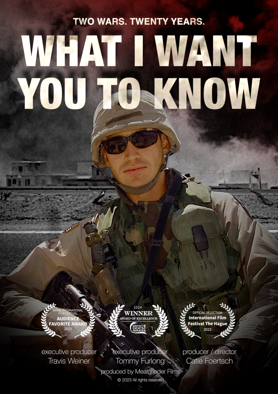 A man in military gear is centered in the poster, he wears a combat helmet, sunglasses and is holding a gun in his hands. The words "What I Want You To Know" span the top of the image. Film festival laurels fill the bottom. 