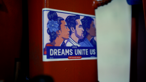 "Dreams Unite Us" Sticker on the boxing ring.